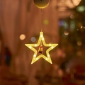 Detail of warm LED star light with miniature Santa figurine and bokeh background - Warm White Star
