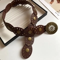Detailed shot of dark brown bohemian belt with metal studs and engraved hollow buckle - 8# Waist Chain - Coffee