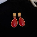 Retro gold drop earrings with deep red teardrop stones on luxury black velvet background - 17# Red Water Drop