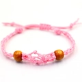 Pulsera artesanal de cordón rosa con cuentas de madera y nudo de cierre ajustable - Pulsera Rosa