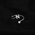 Adjustable silver ring featuring a sparkling micro-pave letter N and a round solitaire diamond - Letter N