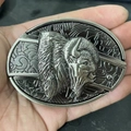 Detail of vintage silver bison head belt buckle with intricate western relief carving - Bison Back