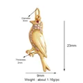 Bird charm pendant in gold finish with white cubic zirconia and red gem eye detail - Red-eye Bird-Gold