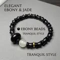 Bracelet en bois de santal style bambou avec perles noires mates et accent de jade - Ébène du Mozambique 8x10mm Forme de Bambou avec Perle Lumineuse