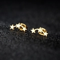 Minimalist gold stainless steel triple star stud earrings on a textured black background - Three Star Style (164) / Gold