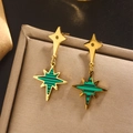 Detail of 18K gold-plated star earrings with green and black shell inlay on a jewelry box - Gold E-396 (Green Black Striped Star)
