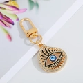 Close-up of teardrop evil eye keychain with gold plating and sparkling rhinestones - Gold Eyelash Teardrop 6