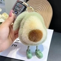 Cute plush avocado keychain with green boots and gold buckle on car key fob - Avocado With Feet