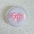 Close-up of white crystal velvet powder puff with pink bow in a clear round storage case - Box Packaging / Large (70*18MM)