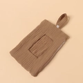 Detail of caramel cotton gauze diaper caddy showing soft texture and snap button strap - Dark Khaki