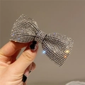 Elegant silver rhinestone bow hair clip featuring a high-shine finish and crystal accents - Style D Spring Clip / White