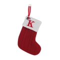 Red knit Christmas stocking with white cuff featuring a red embroidered letter K - Letter K