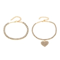 Detail view of double-layered gold rhinestone anklet with heart pendant and lobster clasp - Double Layer Heart / Rose Gold