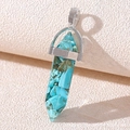 Detail of hexagonal resin pendant with teal stone chips and silver metal bail - Faux Turquoise