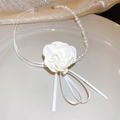 Detail of elegant fabric white rose flower and faux pearl strands on a delicate necklace - White Flower Pearl Necklace