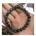 Deep grey labradorite stone bead bracelet for couples with a sleek metallic accent bead - Blue