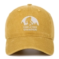 Close-up of Bigfoot embroidery and washed cotton texture on a yellow baseball cap - One Size / Yellow