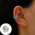 Silver hollow flower ear cuff with sparkling zircon accents on model ear - White K - Hollow Bow Style (X327)