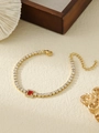 Detailed close-up of gold tennis chain bracelet with white zircons and red square gemstone - Red Rectangular Style (ZHB709 Red)