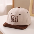 Close-up of beige corduroy baby baseball cap with brown embroidered letter m and soft brim - 50cm (1-3 Years) / Brown