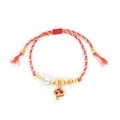Close-up of handmade woven red cotton bracelet with gold beads and mushroom charm - Red Gold Mushroom/Red White Mixed Cord