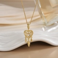 Gold dreamcatcher necklace featuring a heart pendant with moonstone and feather charms - Gold Heart Dreamcatcher