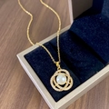 Elegant gold necklace with pearl and sparkling zircon pavé pendant in a velvet jewelry box - Gold Camellia Pearl Necklace