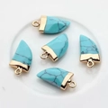 Five turquoise horn-shaped stone pendants with gold metal caps on a white tray - 10x20mm / Light Blue Turquoise