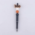 Detail of DIY beadable pen with orange boo focal bead and Halloween silicone beads - BOO Style