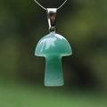 Polished green gemstone mushroom pendant with silver clasp hanging on a thin string - Green Aventurine