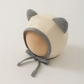 Detailed view of rib-knit newborn hat with cat ears and adjustable chin straps - 0-12 Months / Beige Grey