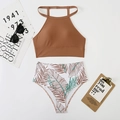 Flat lay of high-waisted bikini set with brown halter top and tropical palm leaf print - S / Caramel Brown