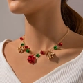 Collier de Noël avec cloches rouges et vertes festives et pendentifs à nœud doré chic - Cloche Rouge Or