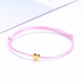 Pink braided rope lucky heart bracelet with adjustable knots and gold heart charm - Pink Gold