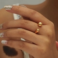 Polished gold adjustable open ring with minimalist double ball design worn on finger - Adjustable Open / Gold Polished Double Ball Style (JZ509GL)