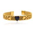Detail of gold woven mesh bracelet with heart-shaped blue gem and floral leaf patterns - Dark Blue