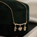 Gold plated necklace with heart pendant featuring zircon paved boy and girl figurines - Style 24655 (Pavé Boy Girl Heart)
