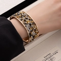 Chic gold wide open cuff bracelet with sparkling multicolor crushed stones for men and women - Black