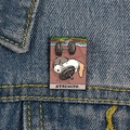 Tarot style cat enamel pin showing strength cat on a blue denim jacket pocket - XC713-Strength Cat