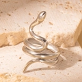 Minimalist silver snake wrap ring with a polished metallic finish on stone surface - Steel Color Style 12