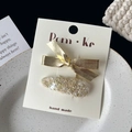 Chic set of two hair clips featuring gold metallic bow and beige sequined tweed designs - Bow with Sequins Clip
