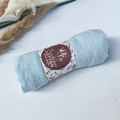Light blue pleated wrinkle cotton shawl with floral logo packaging on white desk - Style #66