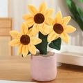 Girasol de peluche sonriente en maceta púrpura con tres flores amarillas decorativas - Rosa