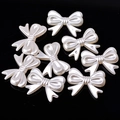 Pearlescent white bow-shaped acrylic beads for DIY crafts on black background - 7# Big Bow 23x29mm 20pcs