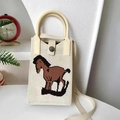 Beige knitted mini tote bag with brown rocking horse pattern and round top handle - Rocking Horse