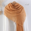Ginger yellow cotton linen scarf for women with fringe details on a wooden hanger - Bright Orange
