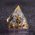 Orgone crystal pyramid with black and white stones and a gold rune symbol for desk decor - Survival - End Bad Luck