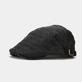 Close-up of black woven straw beret featuring adjustable metal buckle and textured weave - Adjustable / Black