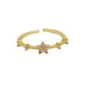 Adjustable 18k gold plated open ring featuring a pink zircon flower and beaded texture - October