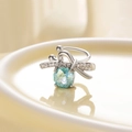 Silver bow ear clip featuring light blue rose cut zircon and shimmering accents - Left Ear / Light Blue (Mint)